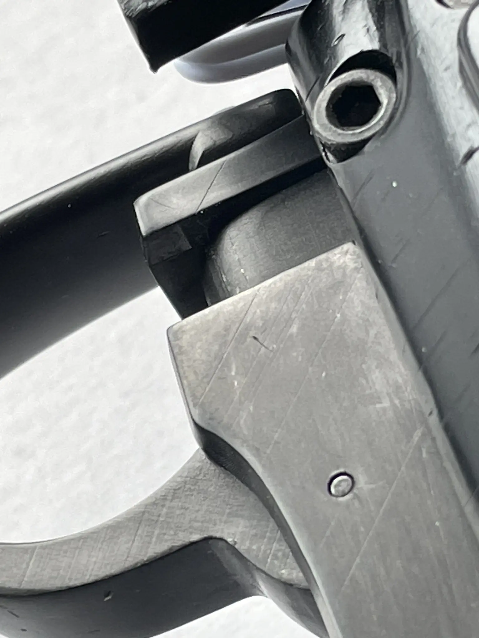 Details of wear effect for blued model pistol